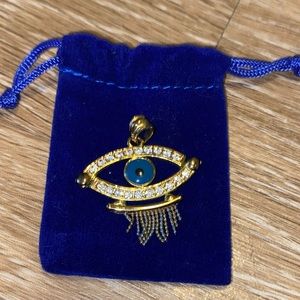 Evil eye gold and turquoise pendant